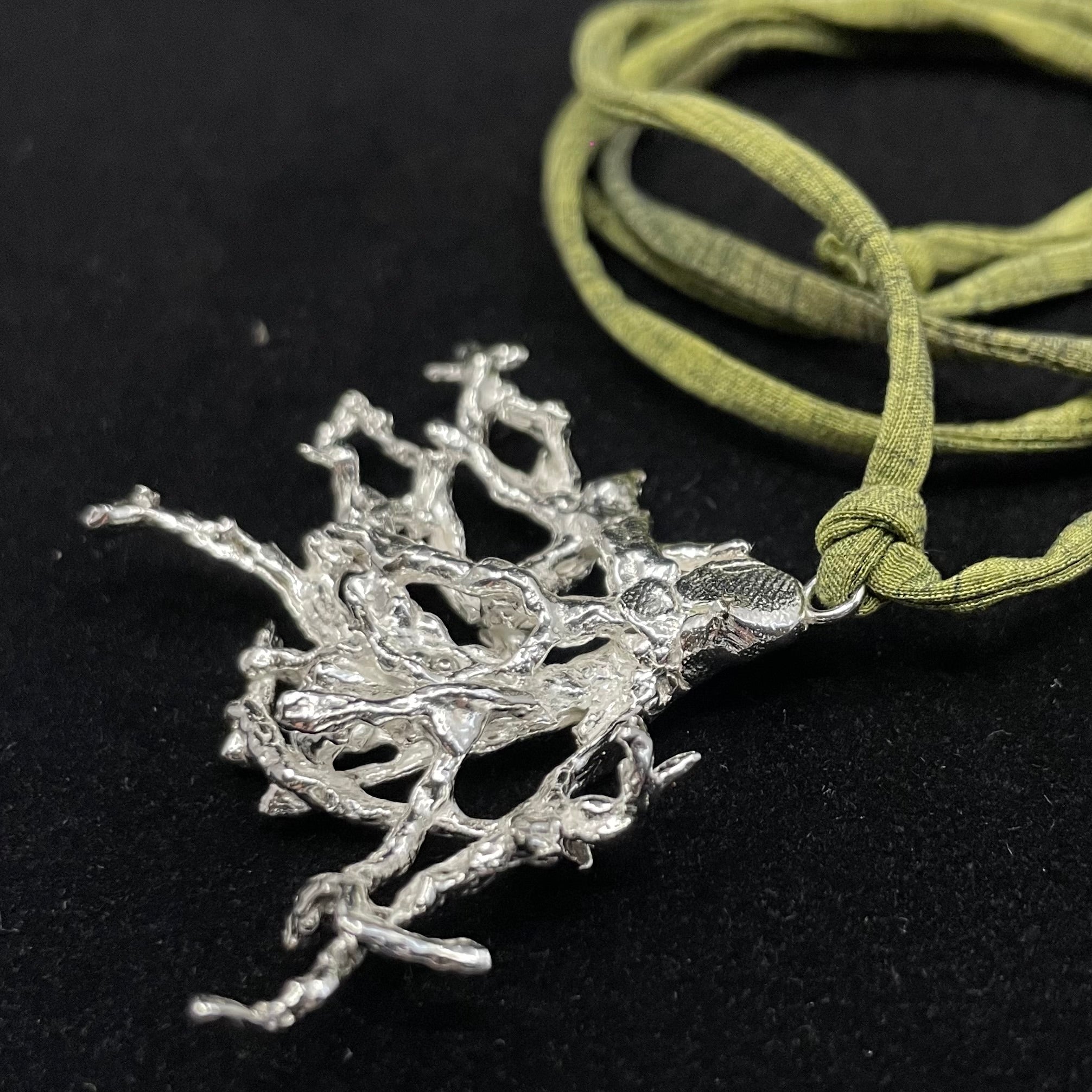 Fruticose Lichen pendant on recycled silk cord.
