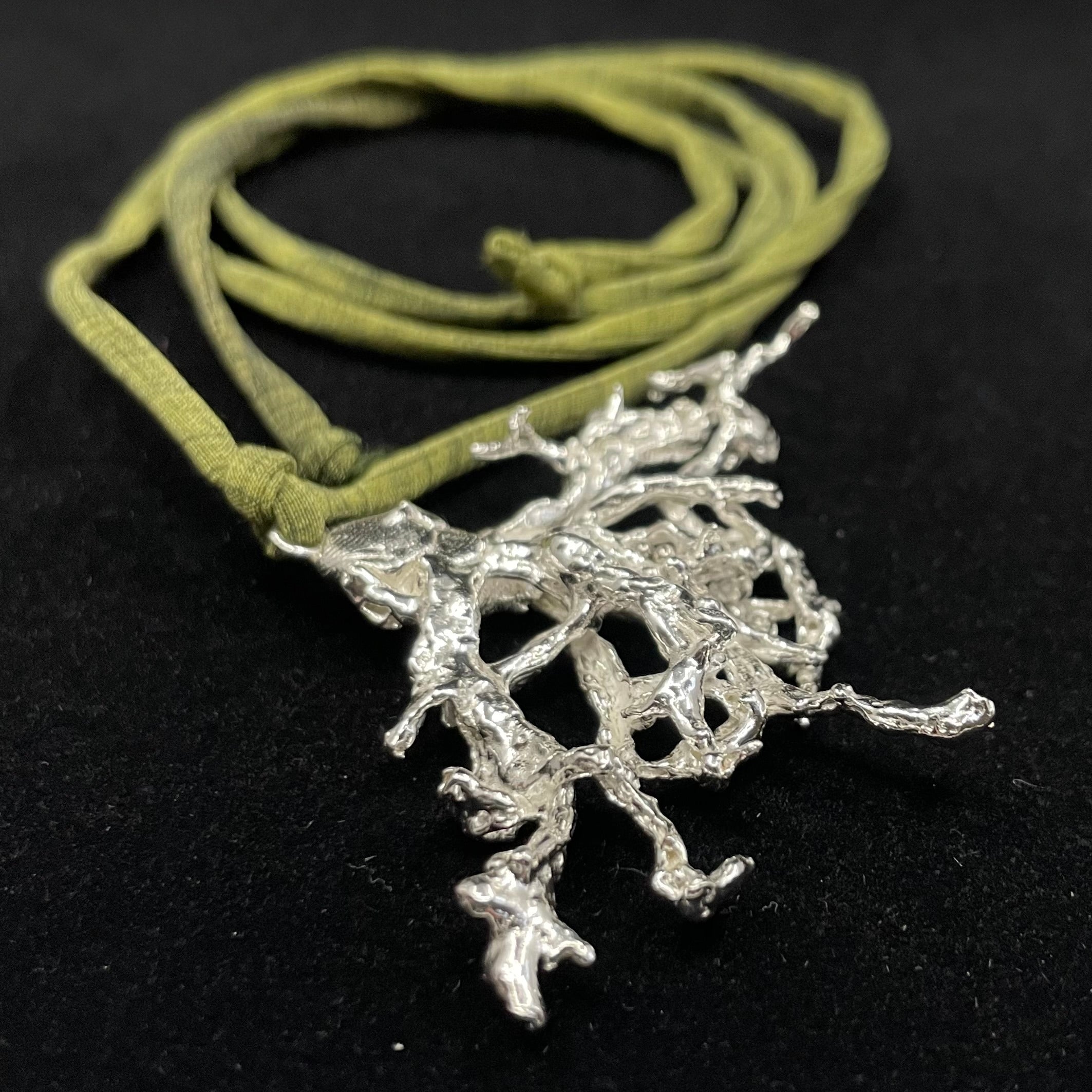 Fruticose Lichen pendant on recycled silk cord.