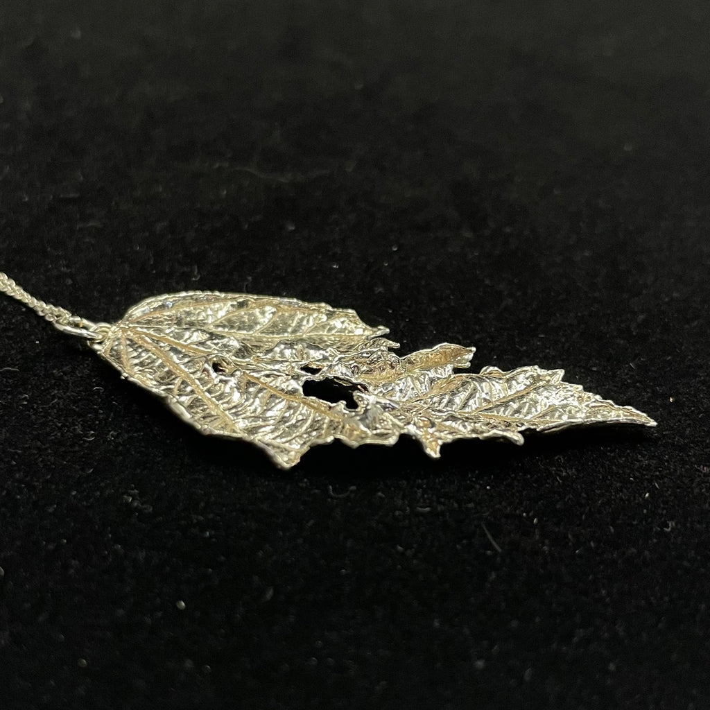 Caterpillar nibbled Bramble leaf pendant