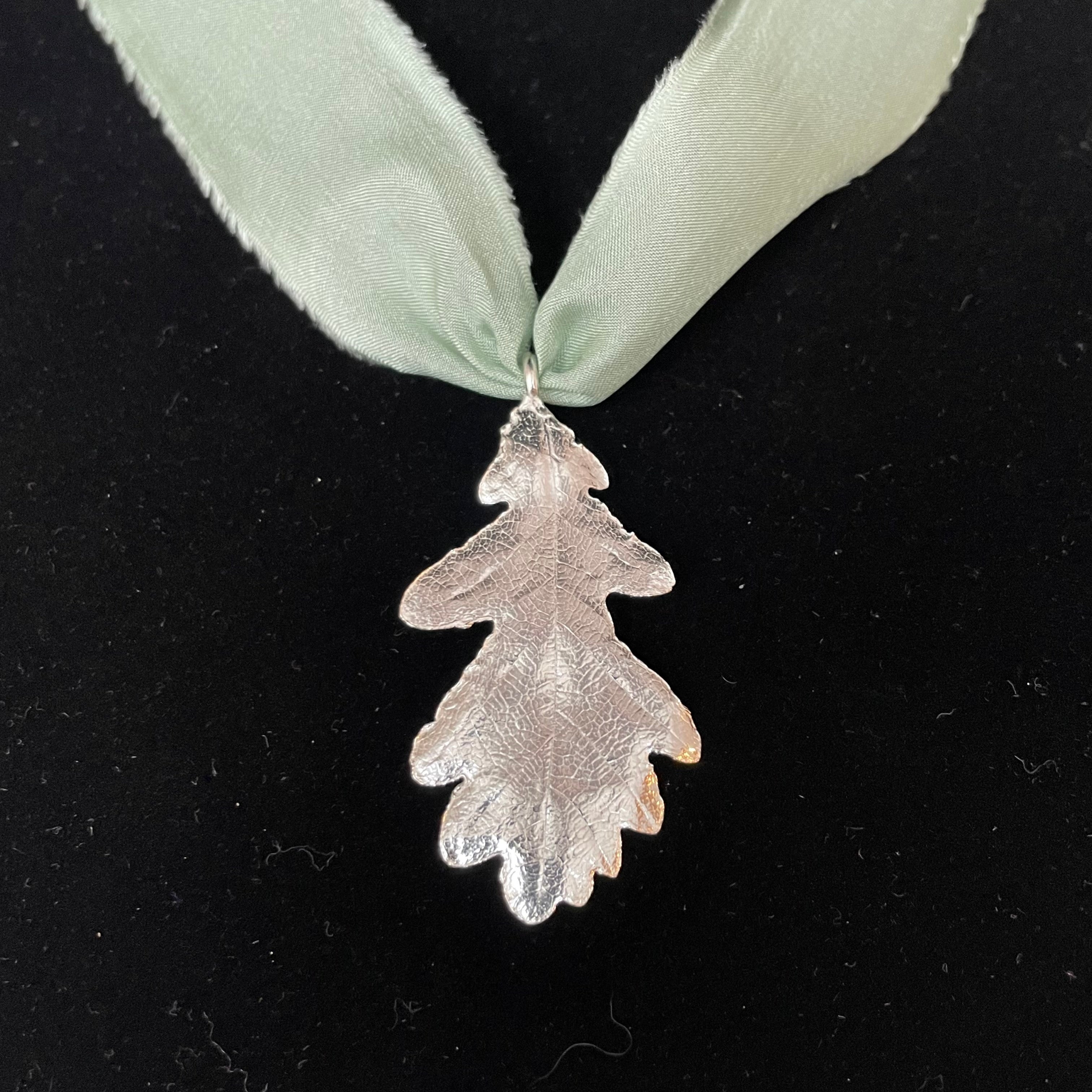 Oak leaf pendant on silk ribbon