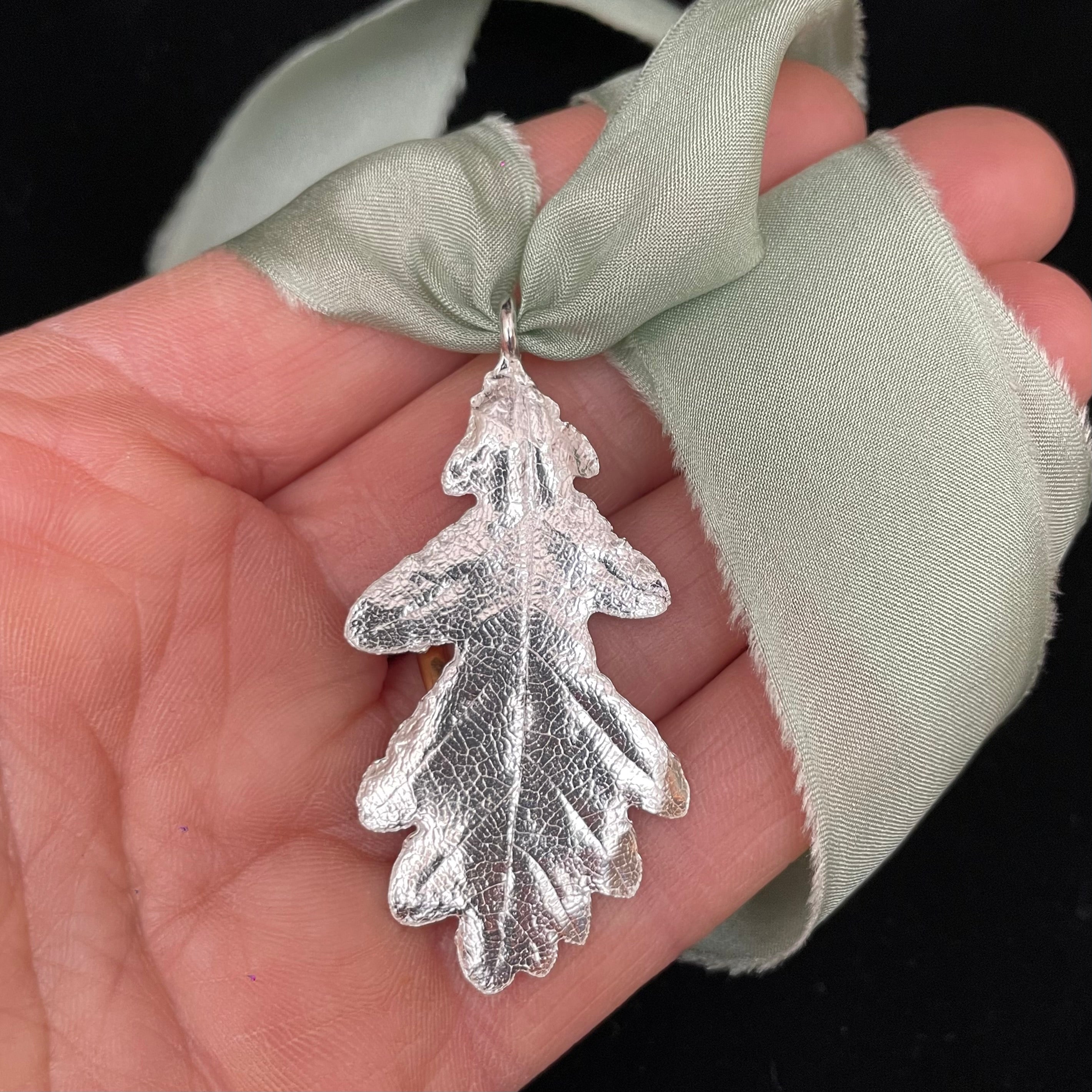 Oak leaf pendant on silk ribbon
