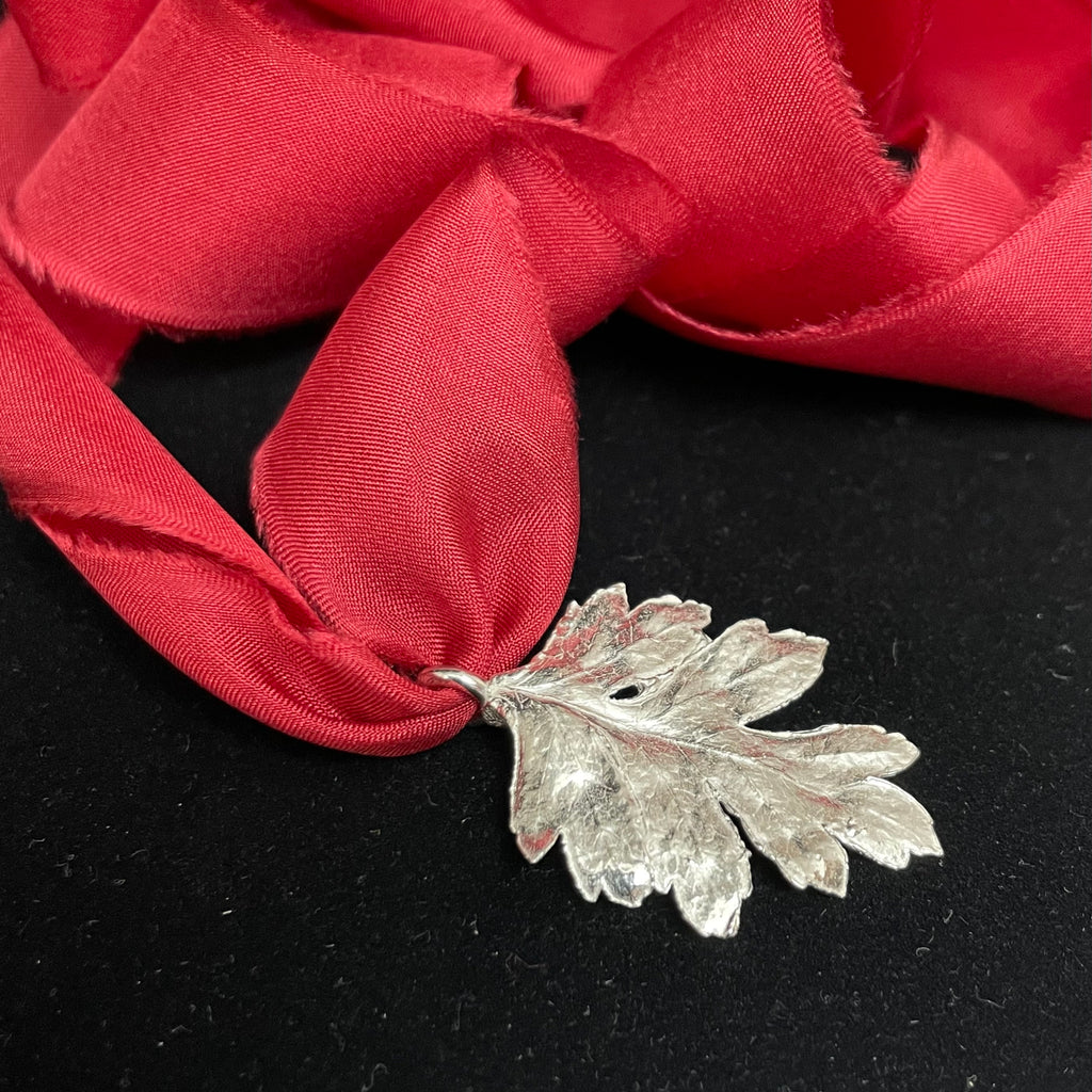 Hawthorn leaf pendant on silk ribbon