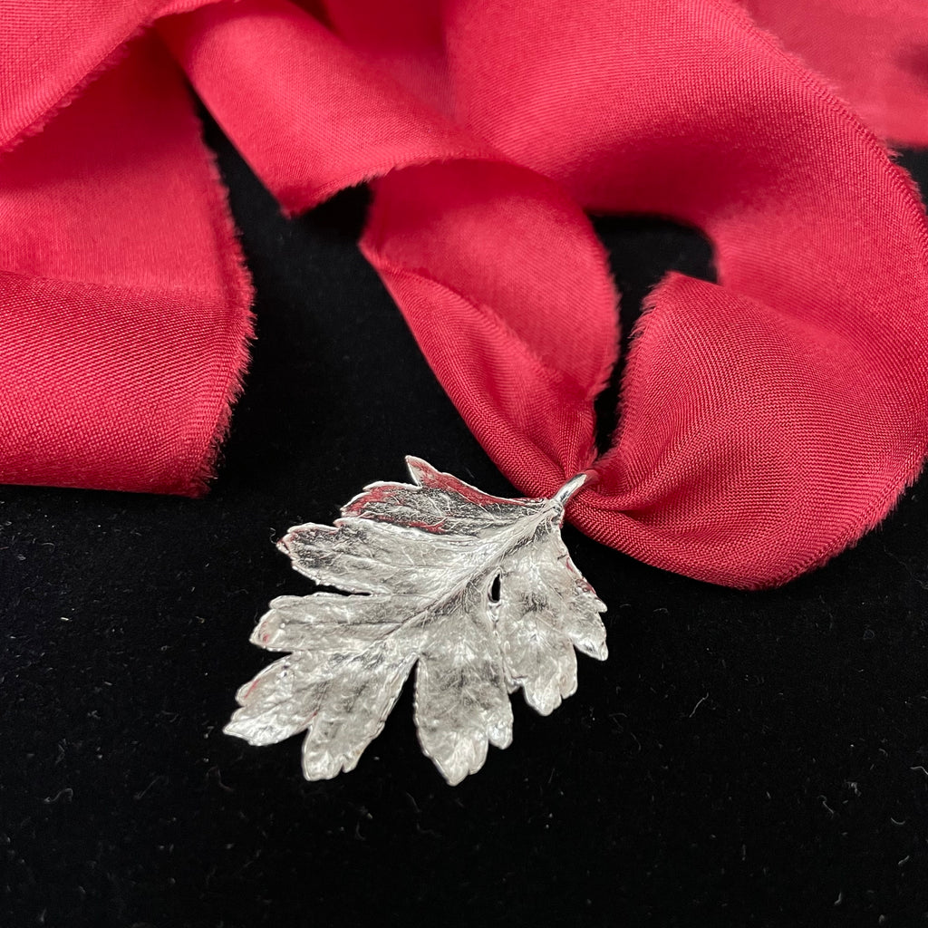 Hawthorn leaf pendant on silk ribbon