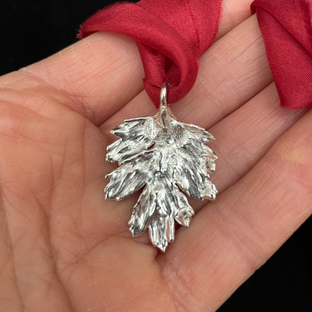 Hawthorn leaf pendant on silk ribbon